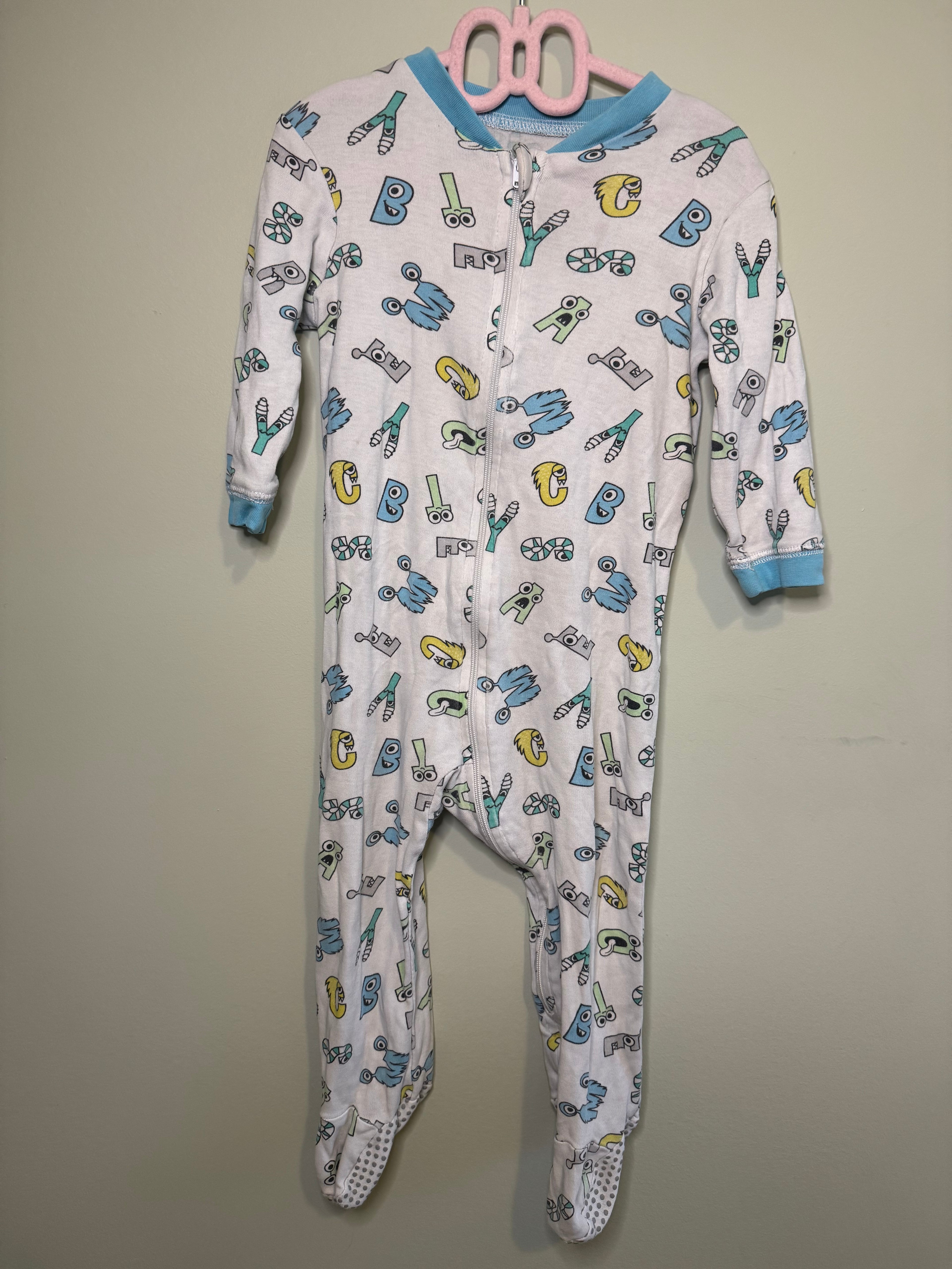 George – Footed Zipper Sleeper (Alphabet Print) – 12–18M